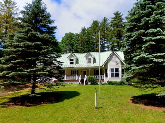 14 Moody Pond Rd, Windsor, ME 04363 - view of front of property with a porch, a standing seam roof, a front lawn, and a metal roof