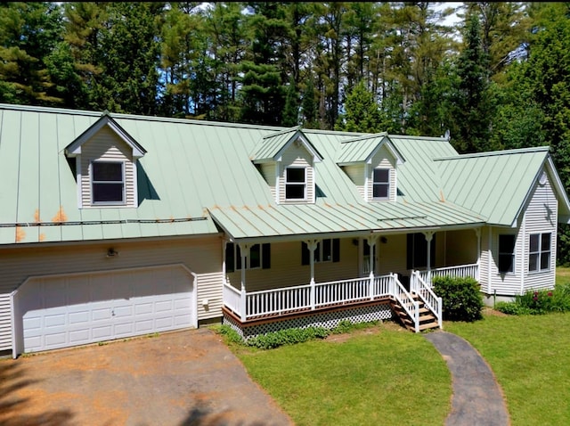 14 Moody Pond Rd, Windsor, ME 04363 - view of front facade with a standing seam roof, covered porch, a front lawn, driveway, and a metal roof