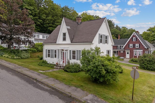 37 Central St, Hallowell, ME 04347 - view of front facade with a chimney, a front yard, and roof with shingles