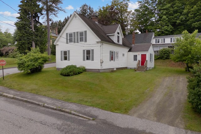 37 Central St, Hallowell, ME 04347 - view of front of house with entry steps, a chimney, a front yard, and roof with shingles
