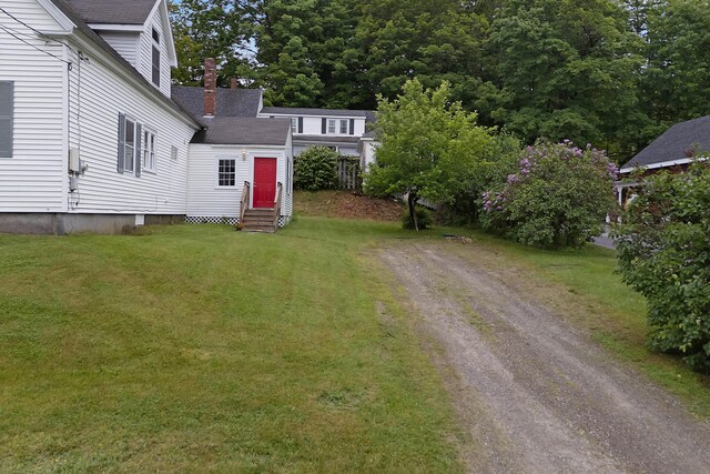 37 Central St, Hallowell, ME 04347 - view of grassy yard featuring entry steps and dirt driveway