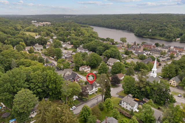 37 Central St, Hallowell, ME 04347 - aerial perspective of suburban area featuring a forest and a nearby body of water