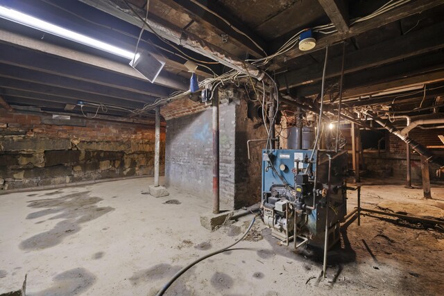 37 Central St, Hallowell, ME 04347 - unfinished basement featuring a heating unit