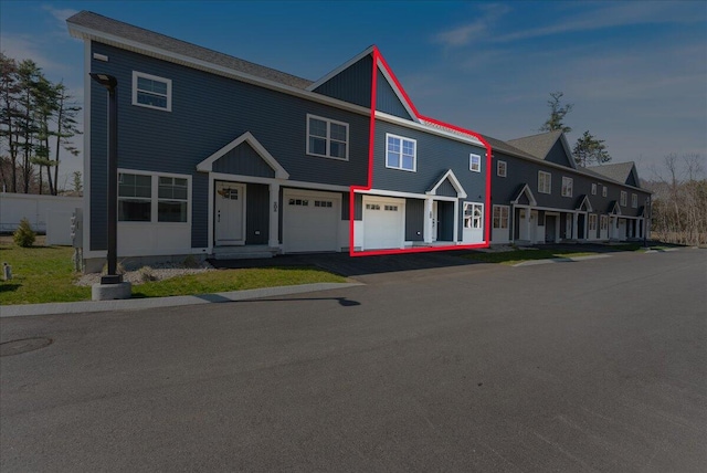50 Ocean Park Rd Unit 102, Saco, ME 04072 - view of property featuring an attached garage and asphalt driveway