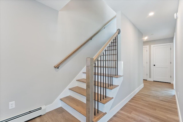50 Ocean Park Rd Unit 102, Saco, ME 04072 - stairway featuring a baseboard heating unit and wood finished floors