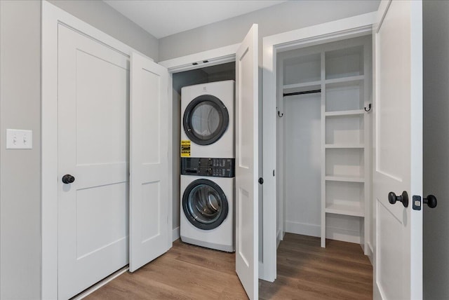 50 Ocean Park Rd Unit 102, Saco, ME 04072 - laundry area featuring stacked washing machine and dryer and wood finished floors