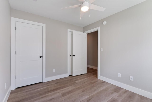 50 Ocean Park Rd Unit 102, Saco, ME 04072 - unfurnished bedroom featuring wood finished floors, a ceiling fan, and a closet