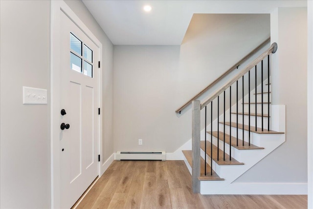 50 Ocean Park Rd Unit 102, Saco, ME 04072 - entryway with baseboard heating, wood finished floors, and stairway