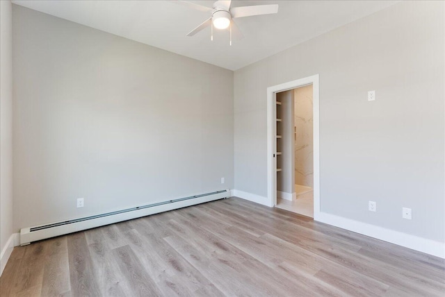 50 Ocean Park Rd Unit 102, Saco, ME 04072 - unfurnished room featuring a baseboard radiator, a ceiling fan, and wood finished floors