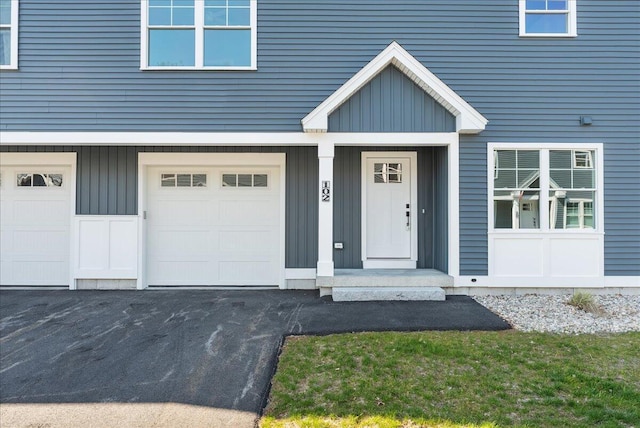 50 Ocean Park Rd Unit 102, Saco, ME 04072 - entrance to property featuring board and batten siding and an attached garage