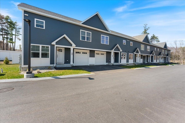 50 Ocean Park Rd Unit 102, Saco, ME 04072 - multi unit property featuring a garage, asphalt driveway, and board and batten siding