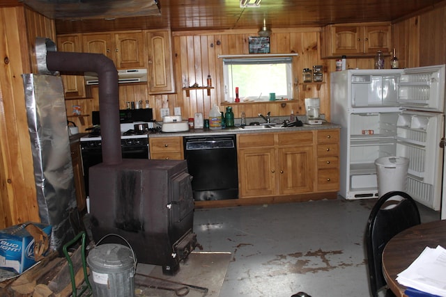 1100 Shin Pond Rd, Mount Chase, ME 04765 - kitchen with black dishwasher, concrete floors, ventilation hood, wood walls, and brown cabinets