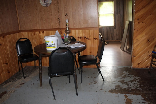 1100 Shin Pond Rd, Mount Chase, ME 04765 - dining space featuring concrete flooring and wood walls