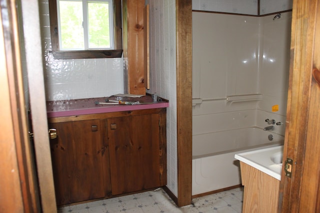 1100 Shin Pond Rd, Mount Chase, ME 04765 - bathroom with tile patterned floors, vanity, and  shower combination