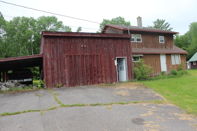 1100 Shin Pond Rd, Mount Chase, ME 04765 - view of front facade featuring a chimney and a front yard