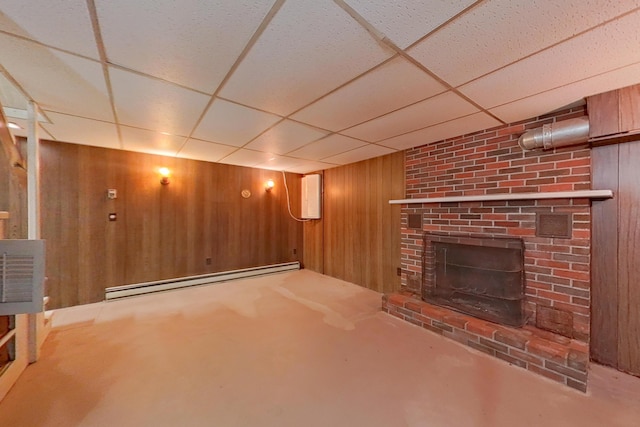 28 Colony Rd, Augusta, ME 04330 - unfurnished living room featuring wood walls, a baseboard radiator, a paneled ceiling, and a fireplace