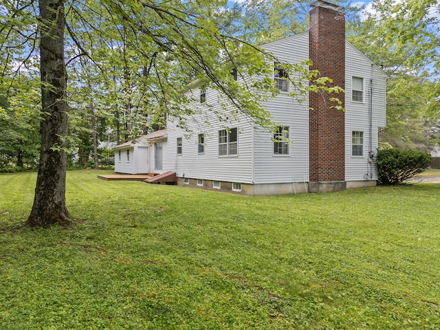28 Colony Rd, Augusta, ME 04330 - view of property exterior featuring a chimney and a lawn