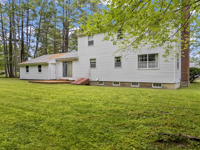 28 Colony Rd, Augusta, ME 04330 - rear view of house with a wooden deck and a lawn