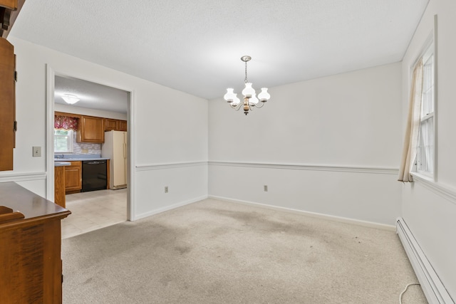 28 Colony Rd, Augusta, ME 04330 - spare room featuring a baseboard radiator, a chandelier, and light carpet
