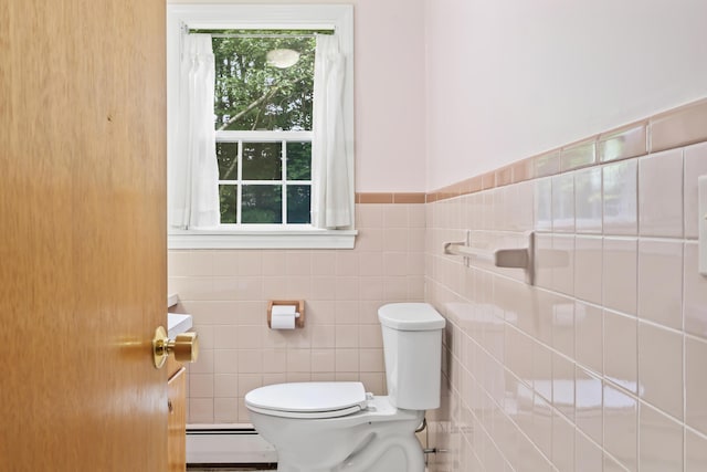 28 Colony Rd, Augusta, ME 04330 - bathroom with a baseboard heating unit, healthy amount of natural light, tile walls, and a wainscoted wall