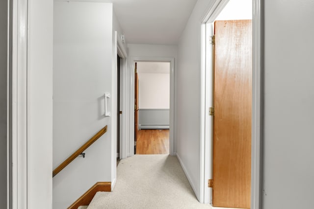 28 Colony Rd, Augusta, ME 04330 - hall with an upstairs landing, baseboard heating, and light colored carpet