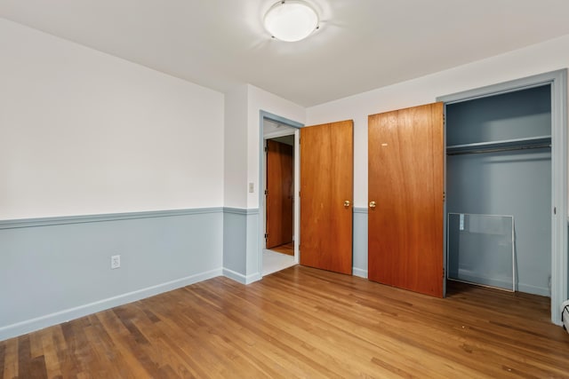 28 Colony Rd, Augusta, ME 04330 - unfurnished bedroom featuring wood finished floors and a closet