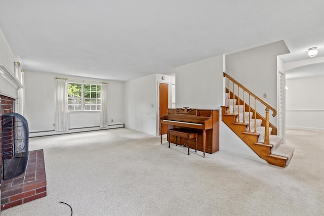 28 Colony Rd, Augusta, ME 04330 - carpeted living area featuring a baseboard radiator, stairs, and a brick fireplace