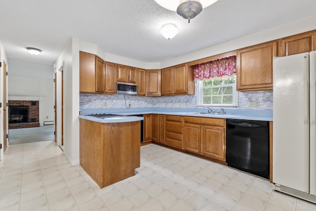 28 Colony Rd, Augusta, ME 04330 - kitchen featuring dishwasher, freestanding refrigerator, stainless steel microwave, light countertops, and brown cabinets