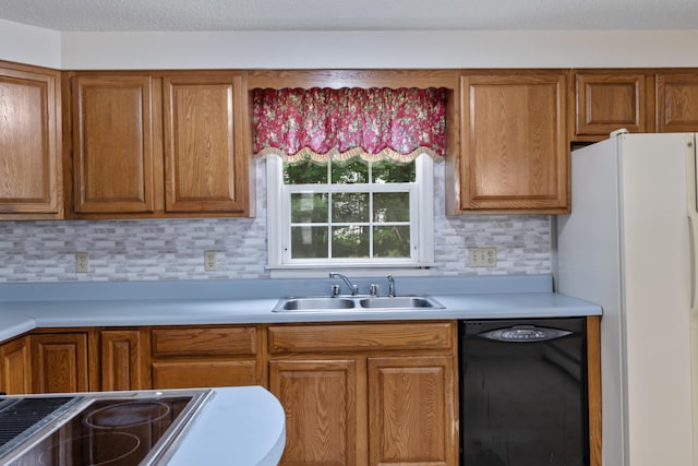 28 Colony Rd, Augusta, ME 04330 - kitchen featuring dishwasher, freestanding refrigerator, light countertops, and brown cabinets