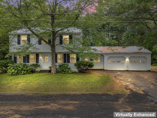 28 Colony Rd, Augusta, ME 04330 - view of front facade featuring driveway, a front lawn, and an attached garage