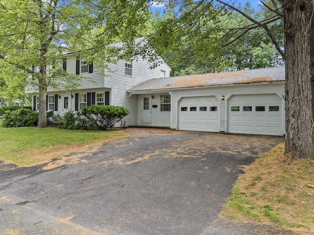 28 Colony Rd, Augusta, ME 04330 - view of front facade with asphalt driveway and a garage