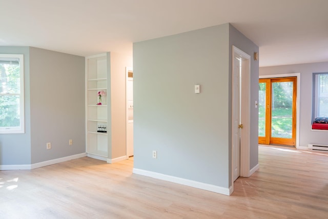 459 Allen Ave Unit 5, Portland, ME 04103 - unfurnished room with light wood-style flooring, plenty of natural light, and built in shelves