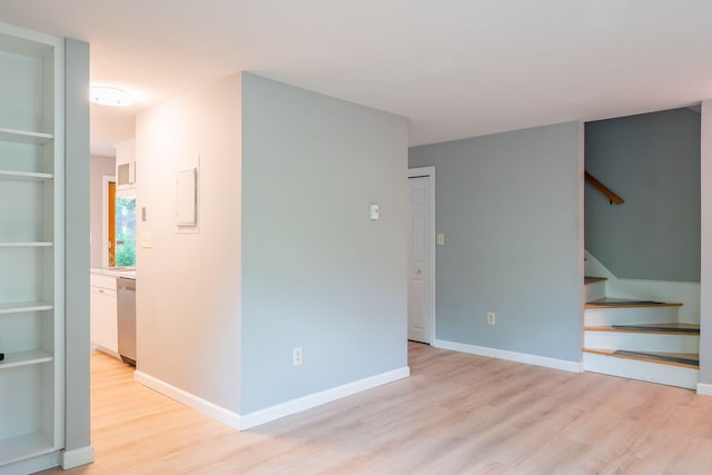 459 Allen Ave Unit 5, Portland, ME 04103 - empty room with light wood finished floors and stairs