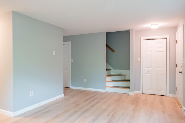 459 Allen Ave Unit 5, Portland, ME 04103 - unfurnished living room with stairs and wood finished floors