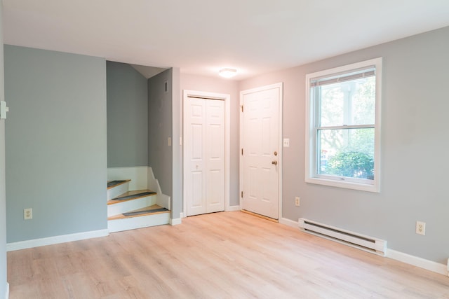 459 Allen Ave Unit 5, Portland, ME 04103 - foyer entrance featuring a baseboard radiator, light wood-style flooring, and stairway
