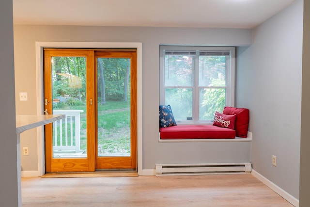 459 Allen Ave Unit 5, Portland, ME 04103 - doorway featuring a baseboard radiator, plenty of natural light, and wood finished floors