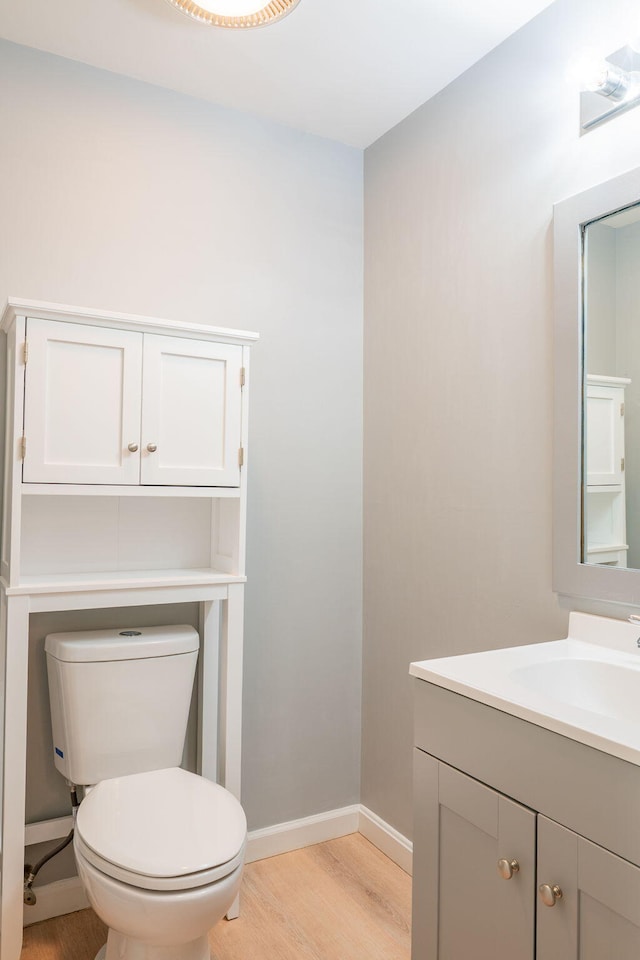 459 Allen Ave Unit 5, Portland, ME 04103 - half bathroom featuring wood finished floors and vanity