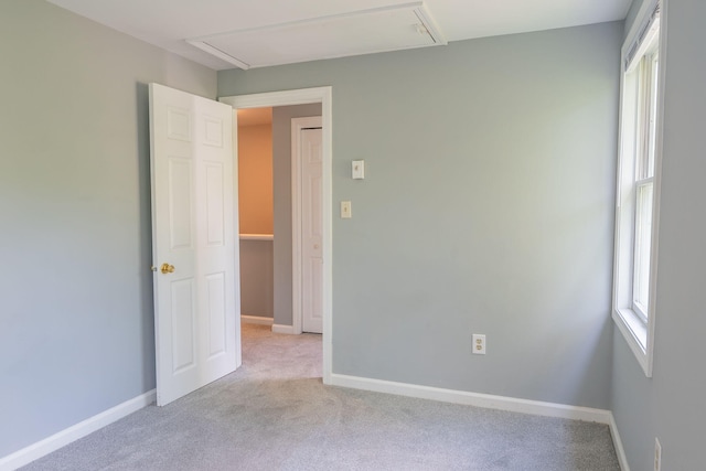 459 Allen Ave Unit 5, Portland, ME 04103 - carpeted empty room with attic access and baseboards