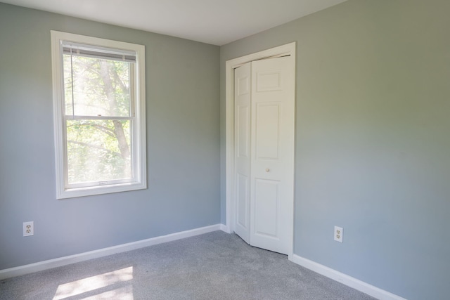 459 Allen Ave Unit 5, Portland, ME 04103 - unfurnished bedroom featuring carpet flooring and a closet
