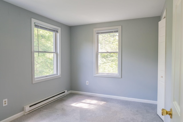 459 Allen Ave Unit 5, Portland, ME 04103 - carpeted empty room with a baseboard heating unit and baseboards