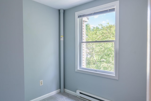 459 Allen Ave Unit 5, Portland, ME 04103 - carpeted empty room featuring plenty of natural light and a baseboard heating unit