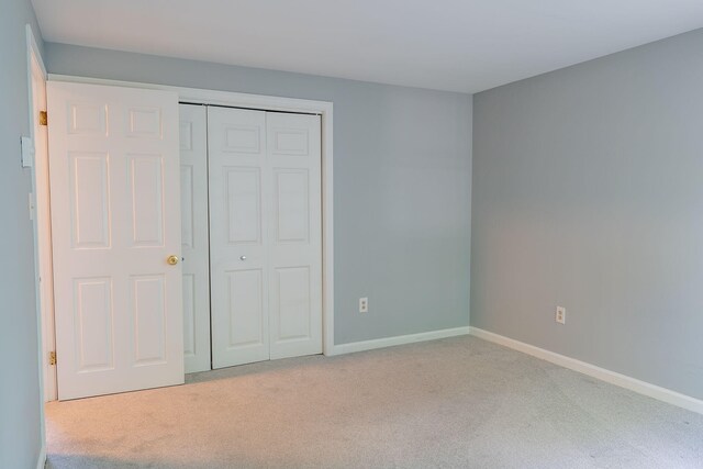 459 Allen Ave Unit 5, Portland, ME 04103 - unfurnished bedroom featuring carpet flooring and a closet