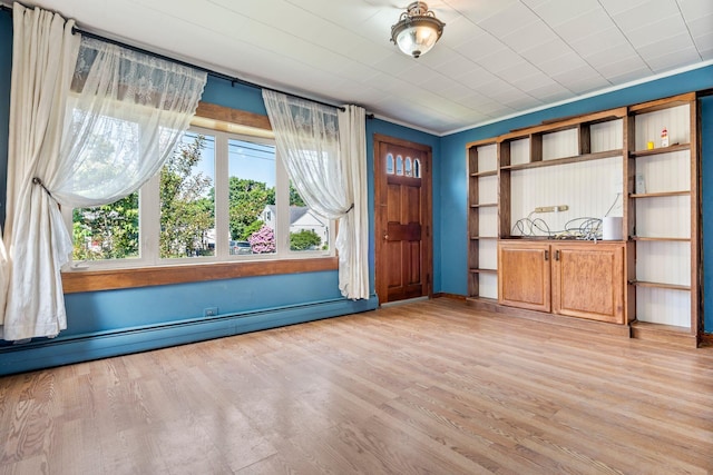 212 Lincoln St, Bangor, ME 04401 - foyer featuring a baseboard radiator and light wood-style flooring