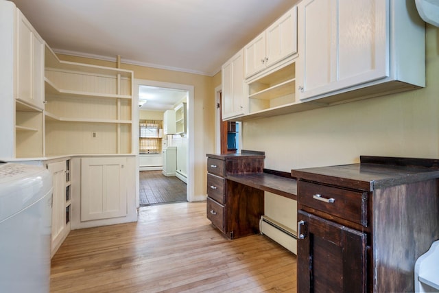 212 Lincoln St, Bangor, ME 04401 - home office featuring baseboard heating, light wood-style flooring, ornamental molding, and built in desk
