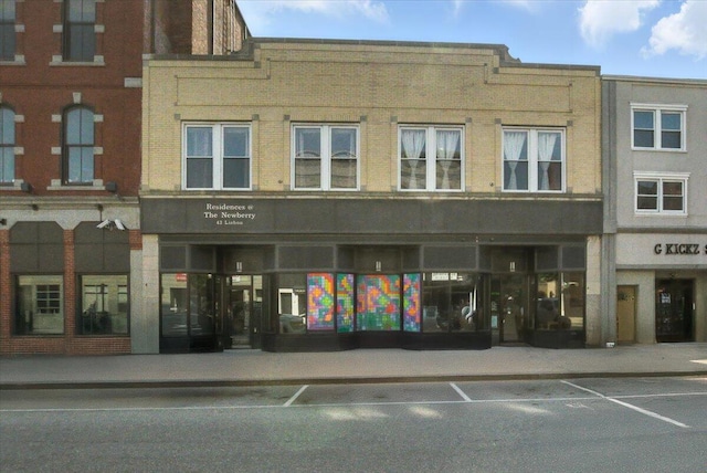 43 Lisbon St Unit 2B, Lewiston, ME 04240 - view of building exterior with uncovered parking