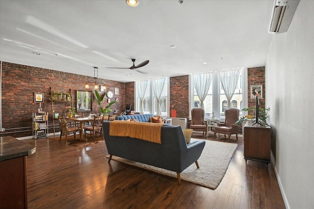 43 Lisbon St Unit 2B, Lewiston, ME 04240 - living area featuring brick wall, a ceiling fan, plenty of natural light, dark wood finished floors, and a wall unit AC