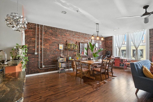 43 Lisbon St Unit 2B, Lewiston, ME 04240 - dining space featuring brick wall, wood finished floors, and a ceiling fan