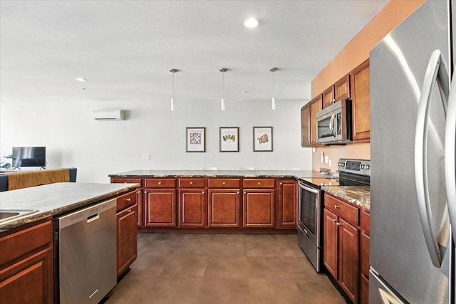 43 Lisbon St Unit 2B, Lewiston, ME 04240 - kitchen featuring stainless steel appliances, pendant lighting, a peninsula, recessed lighting, and brown cabinetry