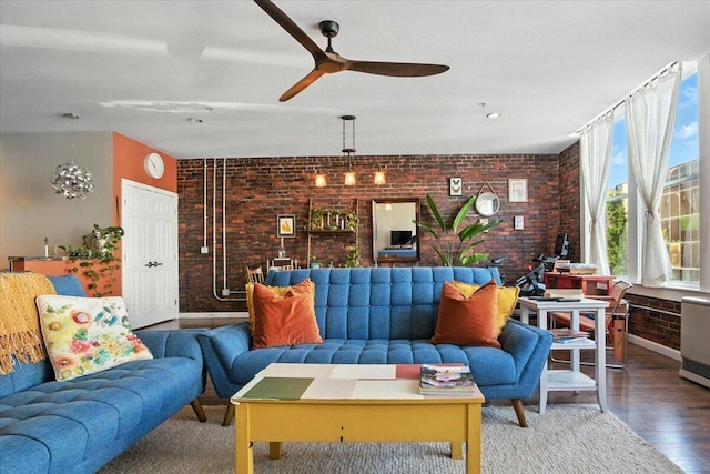 43 Lisbon St Unit 2B, Lewiston, ME 04240 - living room featuring brick wall, a ceiling fan, and wood finished floors