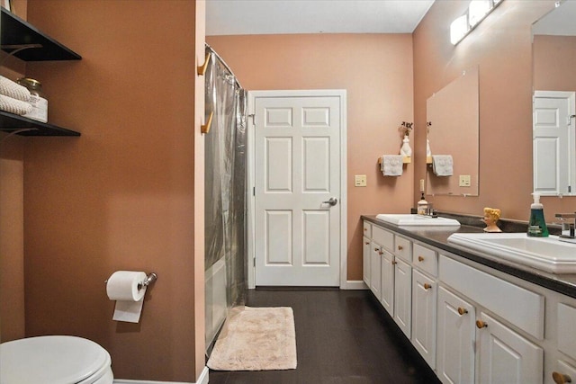 43 Lisbon St Unit 2B, Lewiston, ME 04240 - bathroom featuring double vanity, wood finished floors, and shower / bath combo with shower curtain